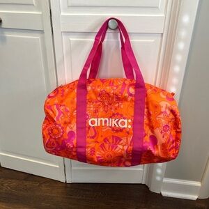 Amika Signature Print Barrel Shape Duffle Bag Color Pink And Orange